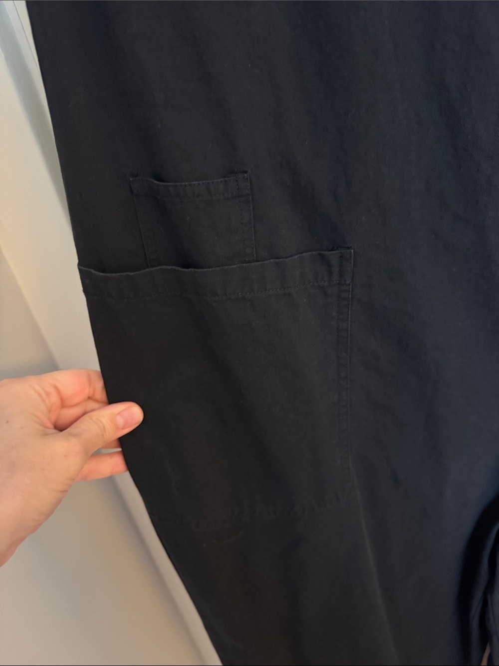 Sleeveless Black Jumpsuit with Front Buttons and utility pockets - Picture 5 of 12